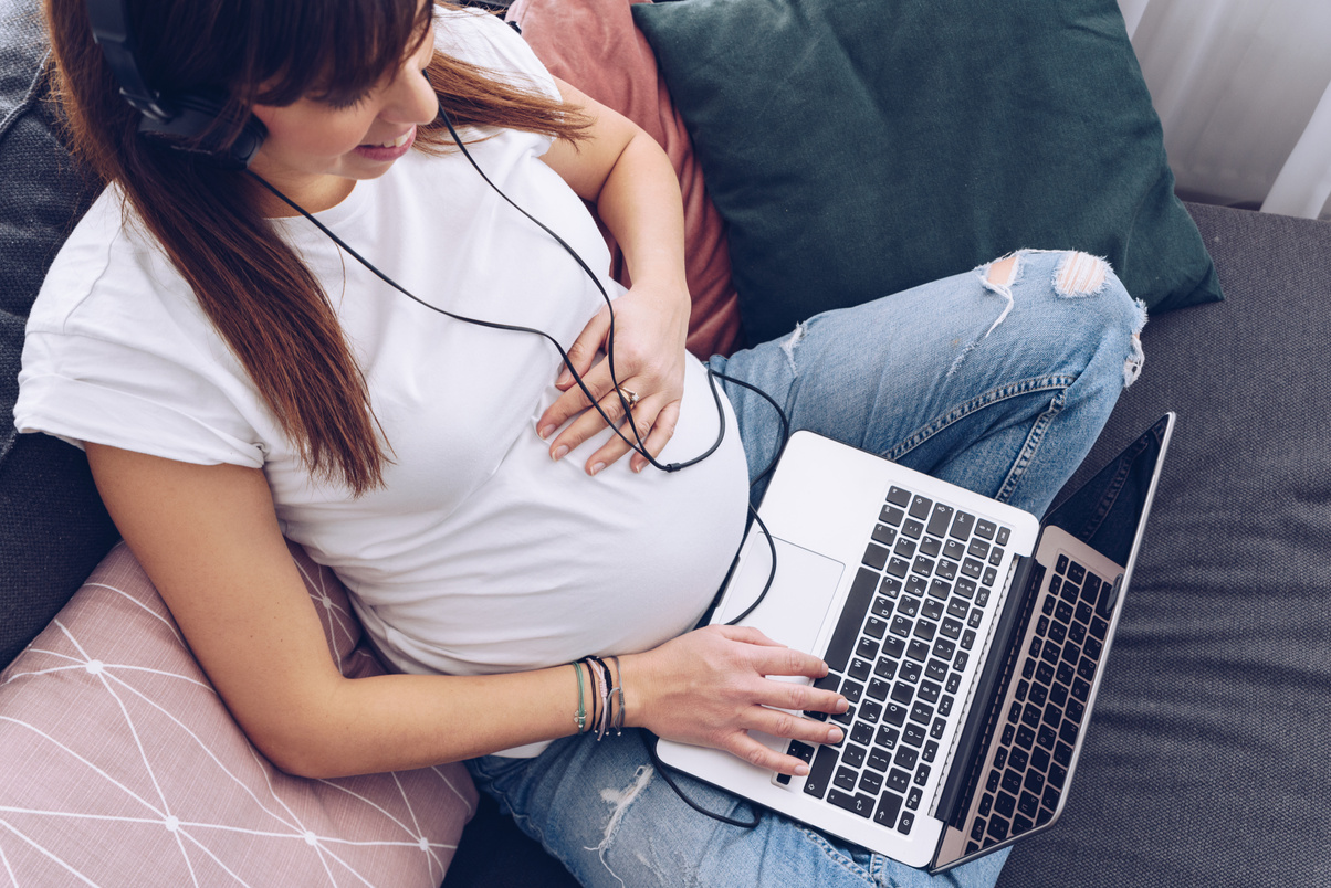 Pregnant Woman Working on Laptop